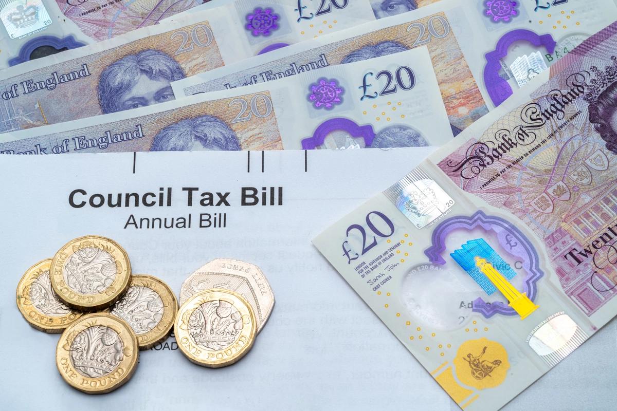 A stock image of money and a council tax bill.