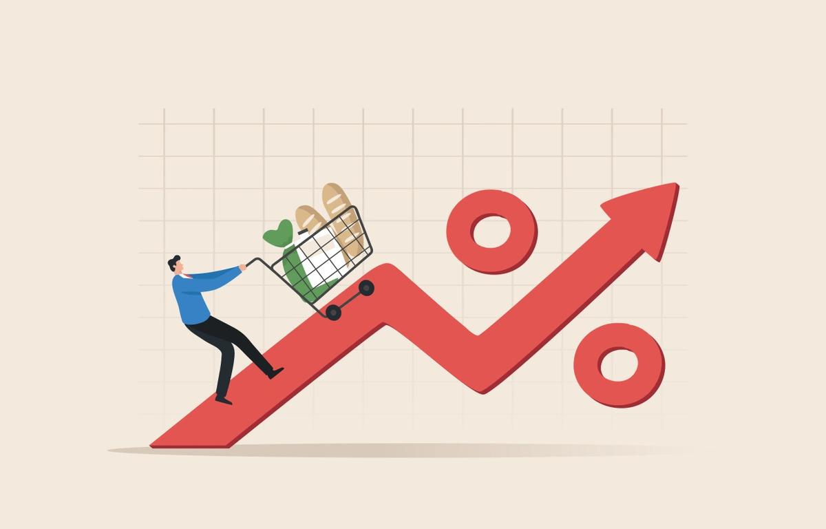 An illustration of a man pushing a trolley of food up an increasing graph, indicating that prices are going up.