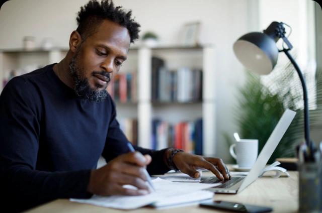 man at desk budgeting