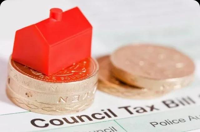 Monopoly house on pound coin and council tax bill