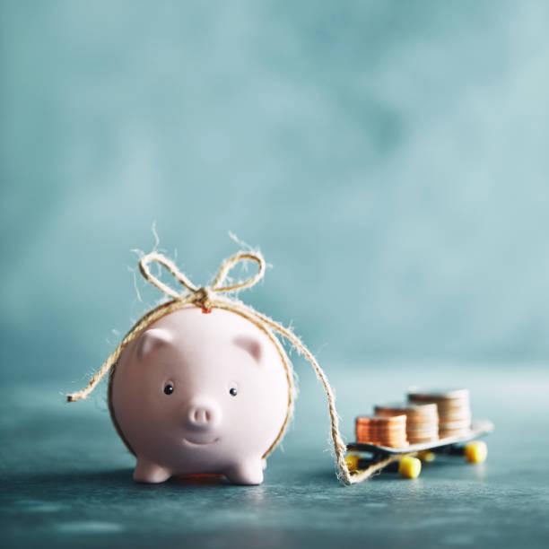 |mage of a piggy bank tied with rope to money. Inflation remains unchanged at 2%. What does inflation mean for your money/household finances?