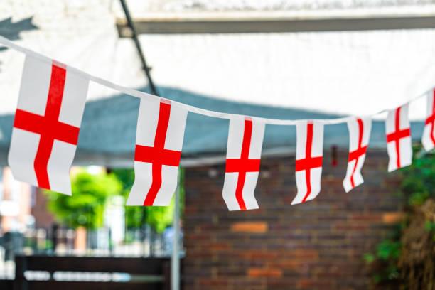 Image of a row of England flags. No spend challenge. Overspent during the Euros - ways to cut back