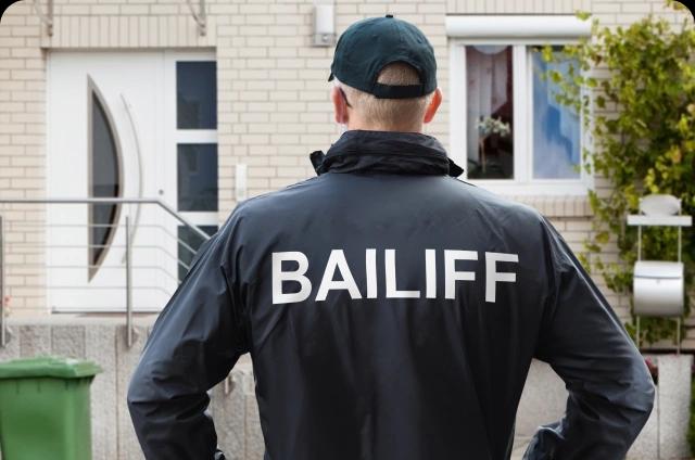 Bailiff outside home