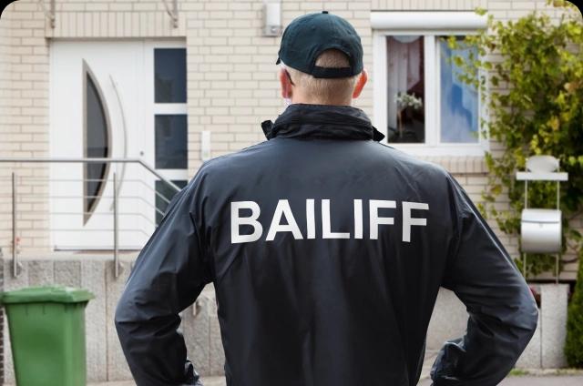 bailiff at door