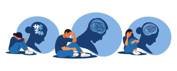 An illustration of a man and two women sat facing the right with their heads lowered. There's a blue silhouette behind each of them with jigsaw puzzle pieces or scribbles where their brains should be, representing mental conditions.