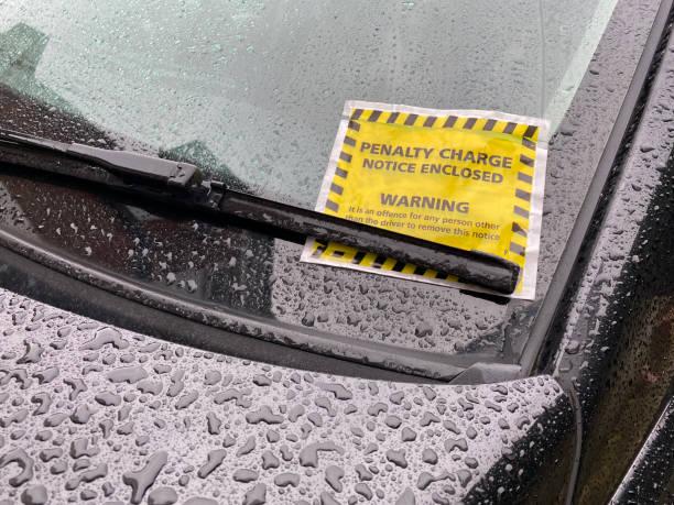 Image of a car with a parking ticket. Where you're most likely to get a parking fine